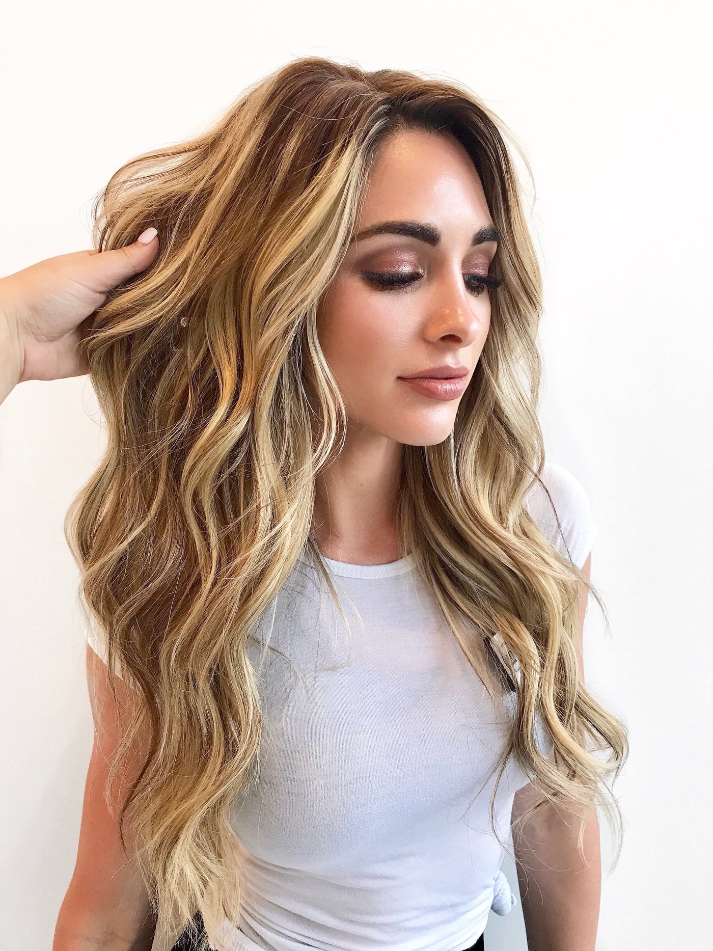 Woman with full, natural-looking human hair by The Lauren Ashtyn Collection