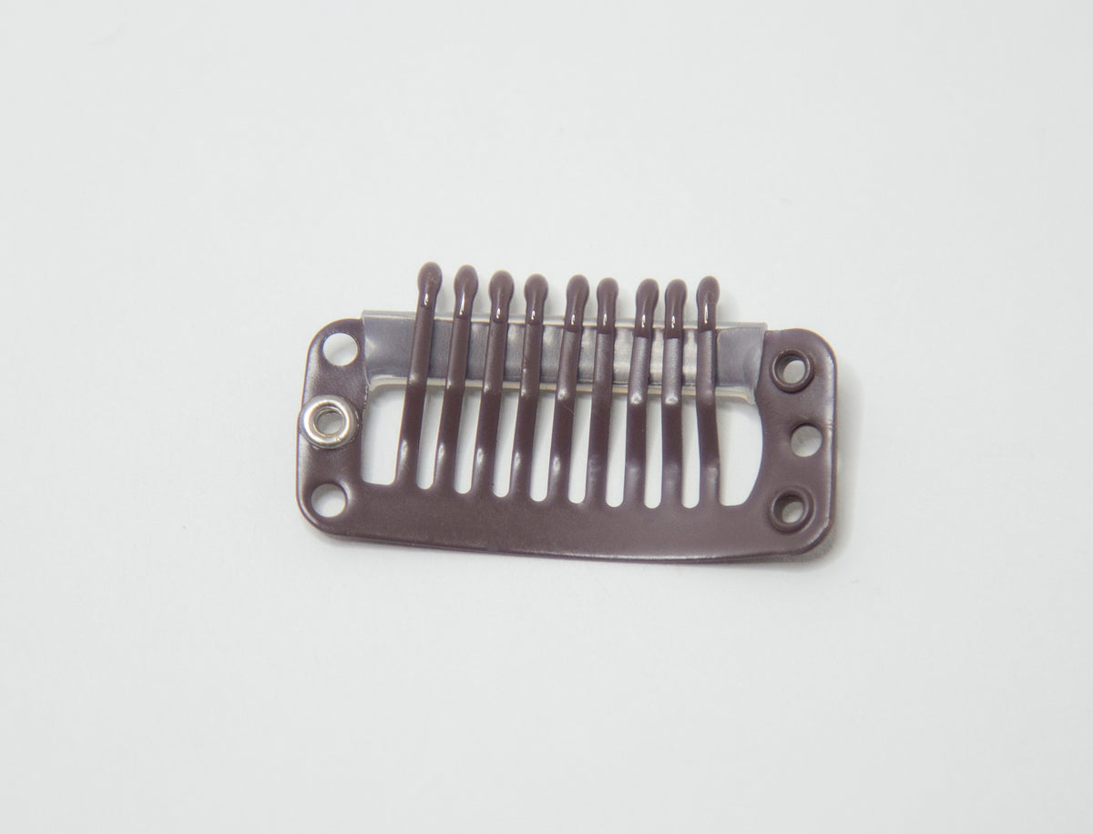 Back of a pressure-sensitive replacement clip used on hair toppers and wigs