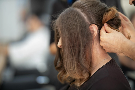 Image of a girl getting her hair done.