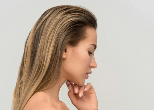 Image of a girl looking down at the floor. 