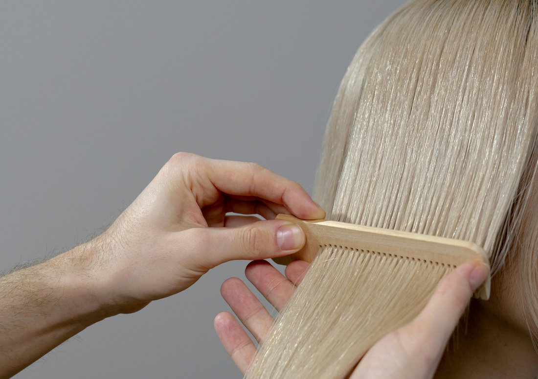 Hair extensions being blended.