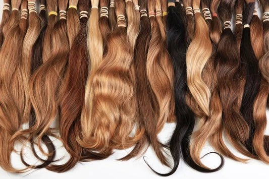 Hair samples for extensions in a range of natural colors.