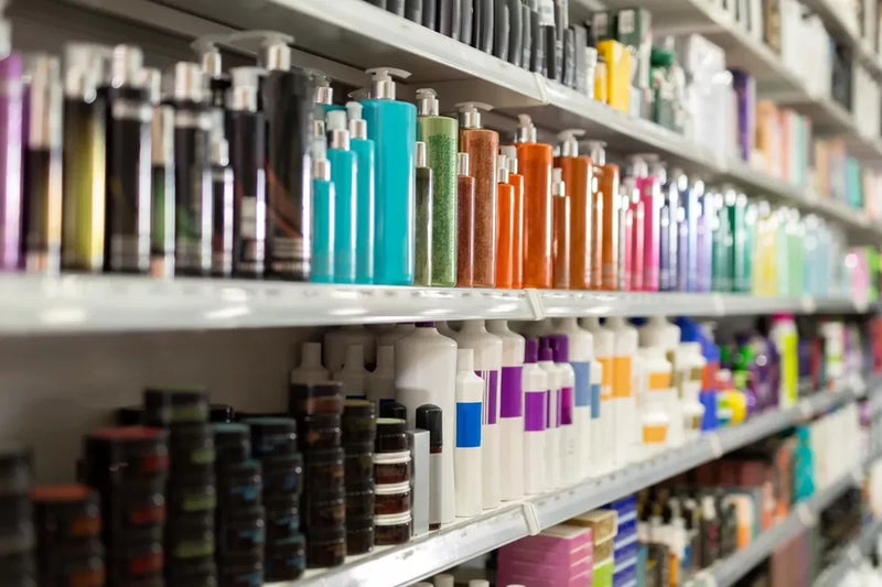 An assortment of colorful hair care products on a store shelf.