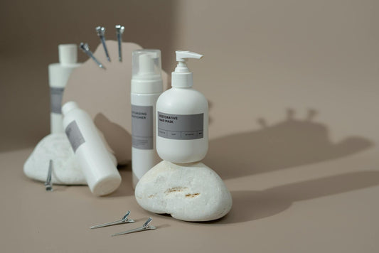 A bundle of hair products, including a hair mask, shampoo, and hair clips.