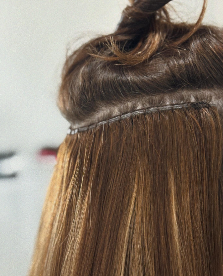 Image of a zoomed in aspect of a hand tied extensions.