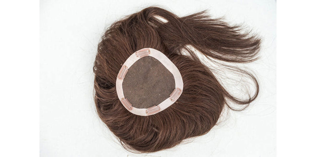 Brunette hair topper showing the inside clips