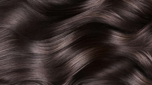 Close up of wavy brown hair.