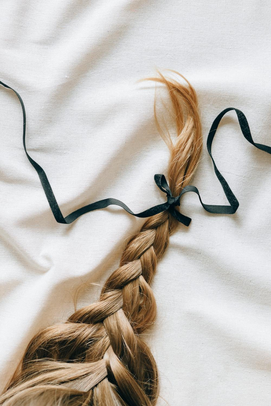 Image of virgin hair in a braid against a white background. Taken from Pexels