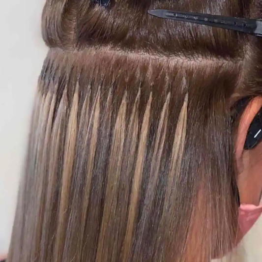 A zoomed-in shot of a woman with keratin bond extensions installed.