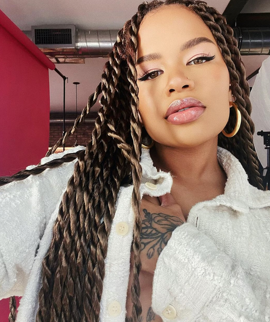 Image of a girl with a protective style.