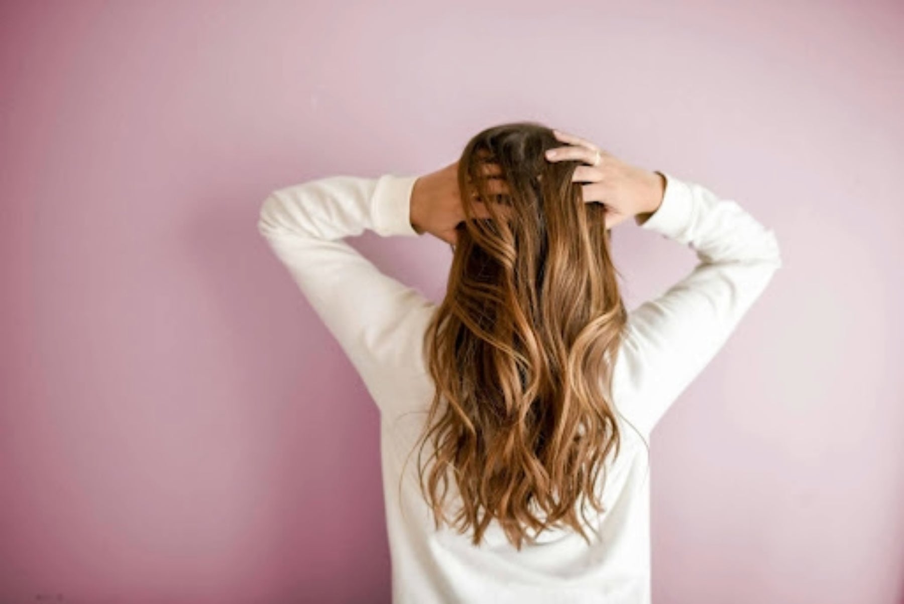 Image of a girl with long blonde hair flowing down her back. Taken from Pexels