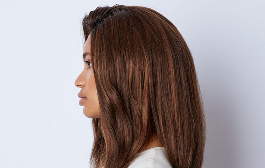 A young woman wearing a natural-looking, human hair wig.