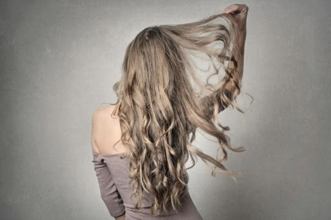 Image of a woman with a long set of Remy hair extensions. Taken from Pexels.