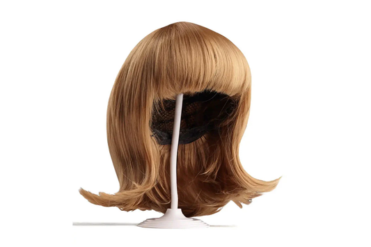 Image of a wig on a wig stand. 