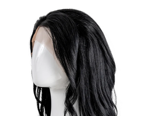 Image of a human hair wig on a wig stand.