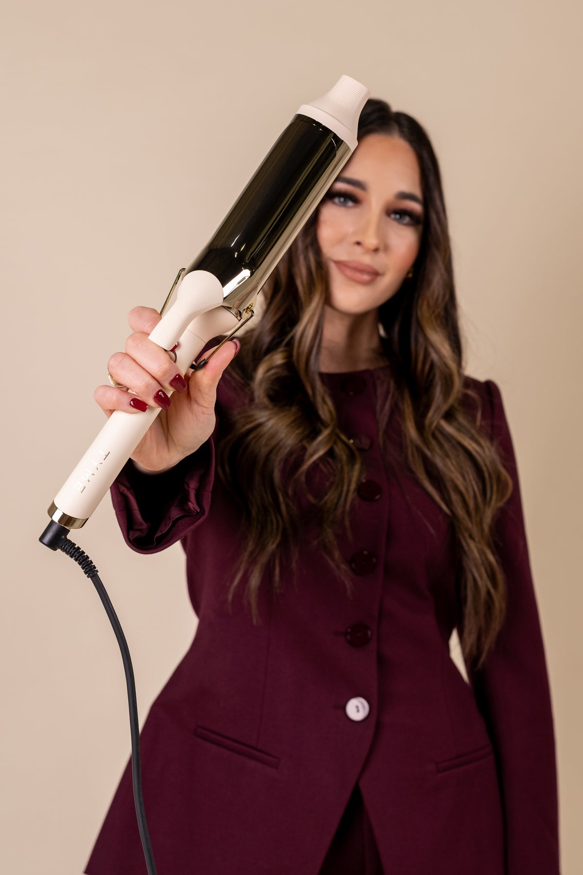 A happy client seeing her natural-looking hair in the mirror