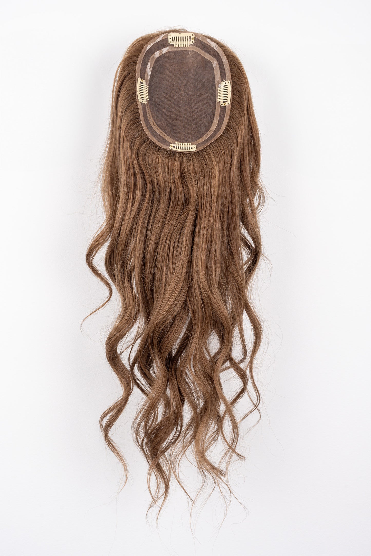 Bottom view of a Bella Brown Full Volume Hair Topper