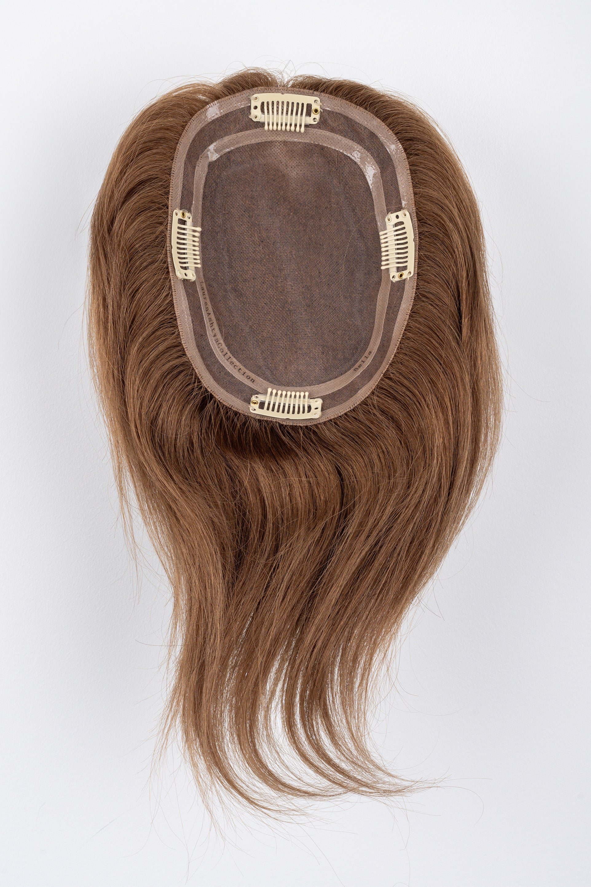 Bottom view of a Bella Brown Full Volume Hair Topper