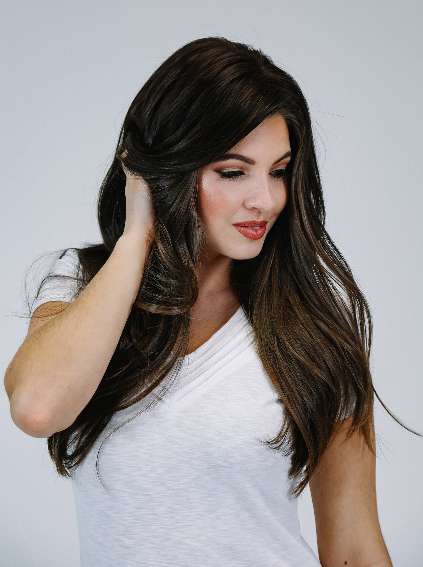 Woman wearing brown hair extensions- front view