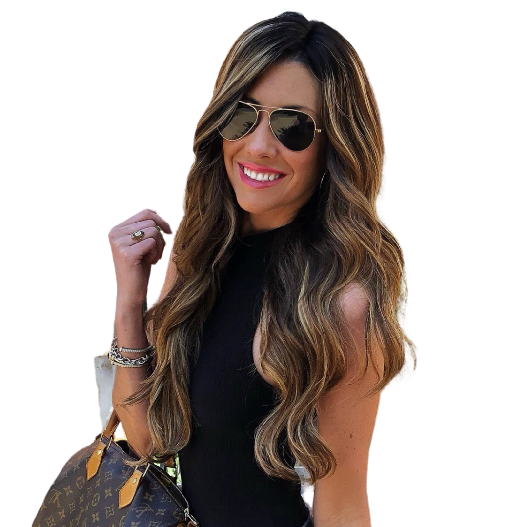 Woman wearing sunglasses and our amber balayage full volume extension