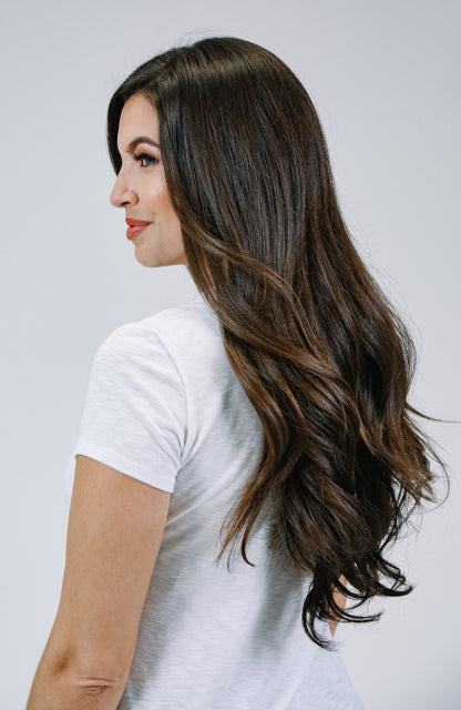 Woman wearing brown hair extensions - side view